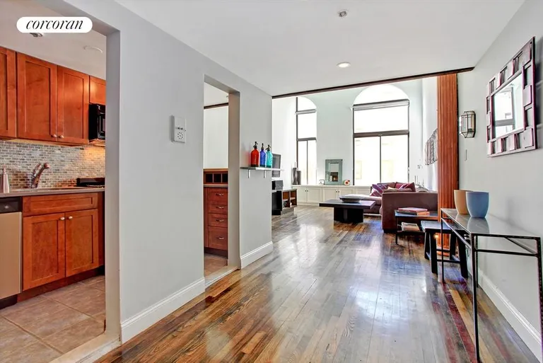 New York City Real Estate | View 67 East 11th Street, 412 | Open Kitchen and soaring south facing living room | View 3
