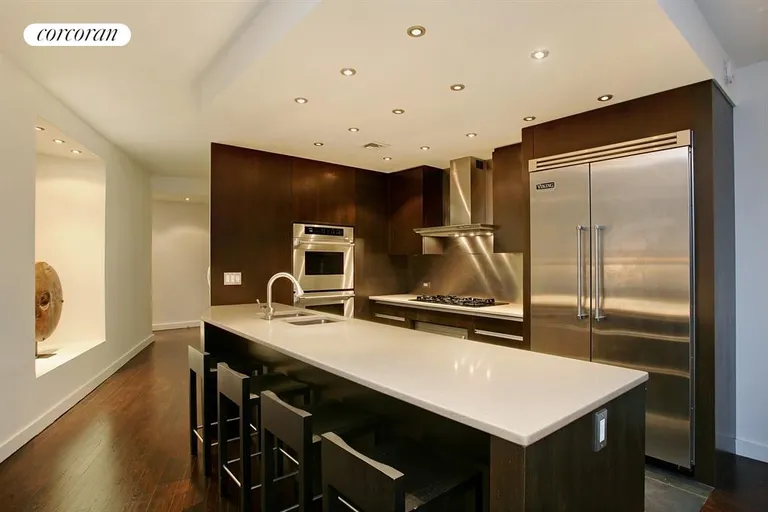 New York City Real Estate | View 167 East 61st Street, 22AB | Open chef's kitchen with seating and ample storage | View 3