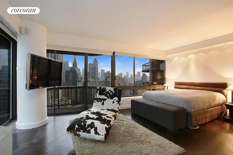 New York City Real Estate | View 167 East 61st Street, 22AB | South and east facing master bedroom with balcony | View 4