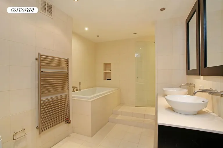 New York City Real Estate | View 167 East 61st Street, 22AB | Master bath with separate shower and soaking tub | View 5