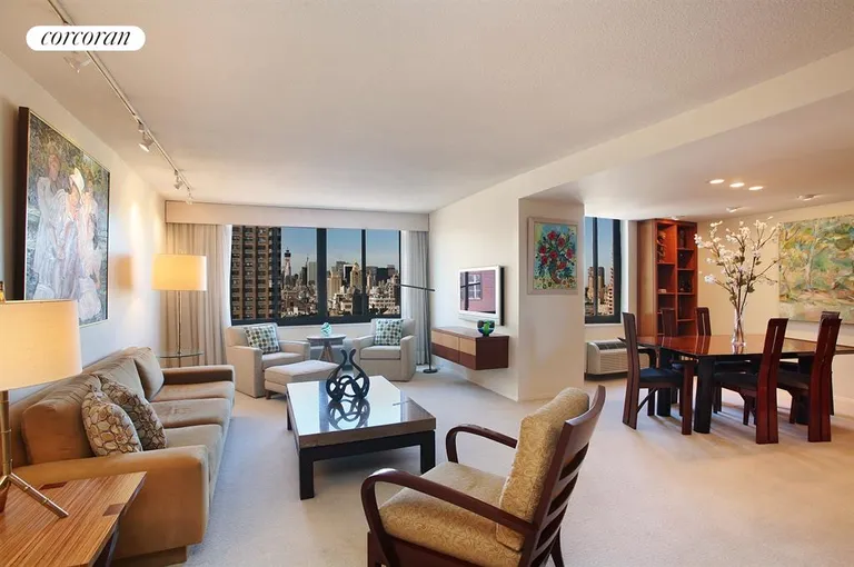 New York City Real Estate | View 115 East 87th Street, 22C | Wide Living Room & DA with skyline views | View 3