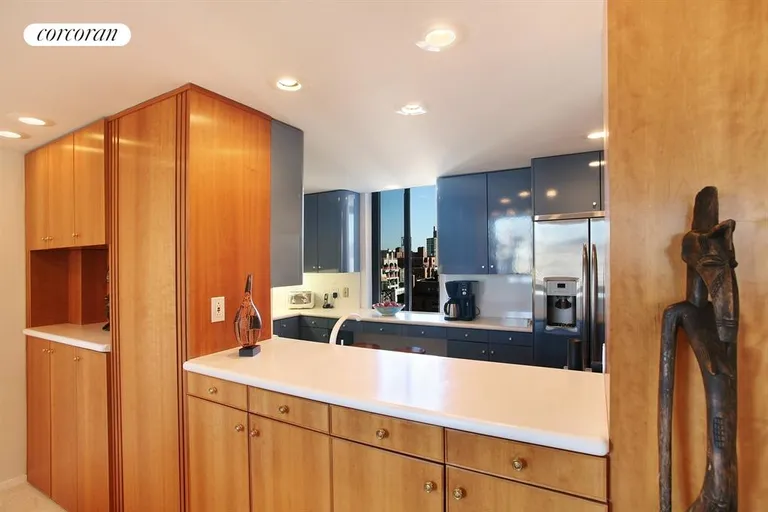 New York City Real Estate | View 115 East 87th Street, 22C | Pass thru Kitchen with custom cabinetry | View 6