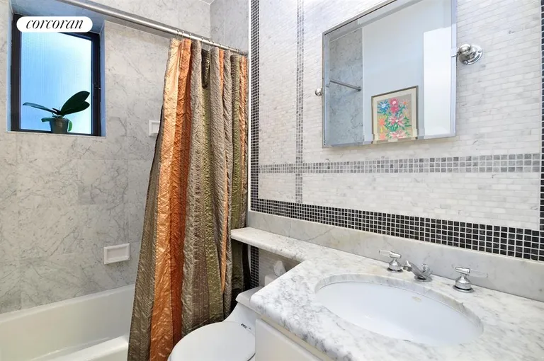 New York City Real Estate | View 45 East 25th Street, 11A | Windowed bath in white Carerra marble | View 5