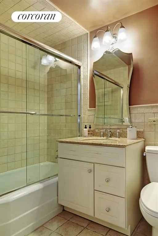 New York City Real Estate | View 205 East 63rd Street, 6H | Renovated bathroom with marble tile | View 6