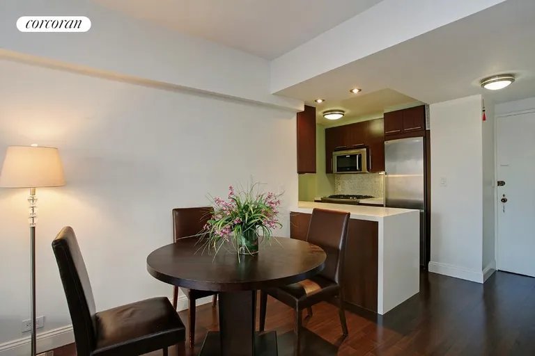 New York City Real Estate | View 225 East 57th Street, 16A | Open kitchen and dining area | View 2