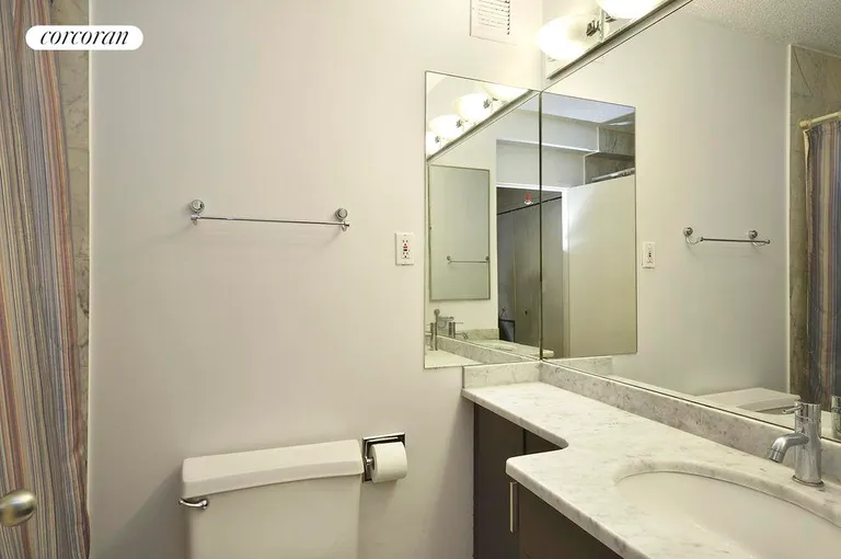 New York City Real Estate | View 300 Rector Place, 8H | White marble counter and floor | View 3