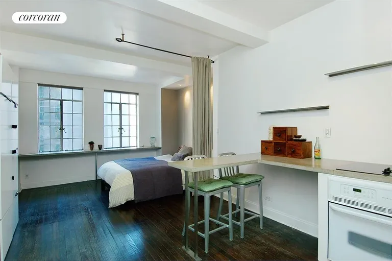 New York City Real Estate | View 320 East 42Nd Street, 704 | Kitchen to Bedroom area | View 3