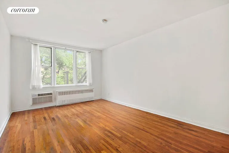 New York City Real Estate | View 311 East 75th Street, 6H | Living area with wall of windows | View 3