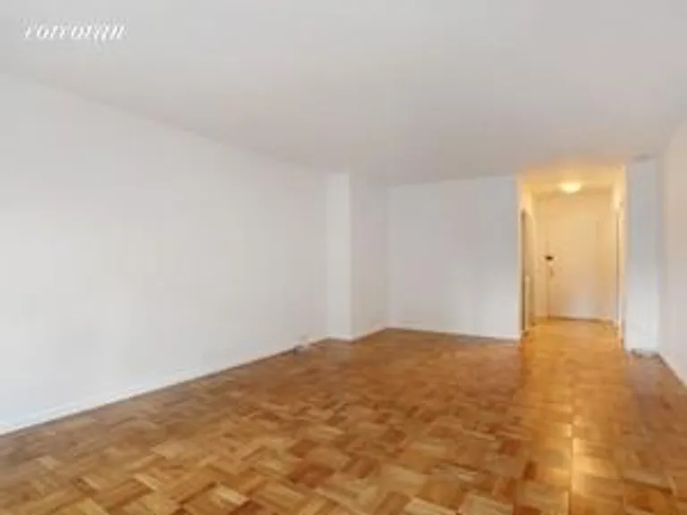 New York City Real Estate | View 118 East 60th Street, 5D | Living Room and Entrance | View 3