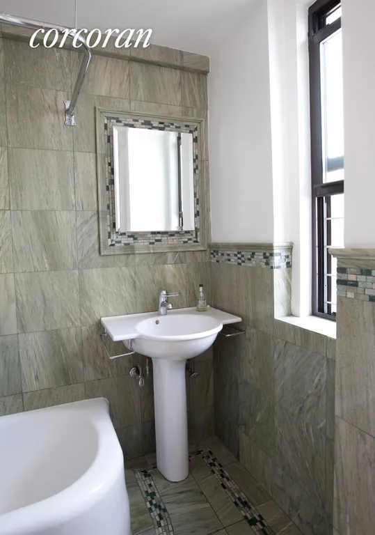 New York City Real Estate | View 333 East 53rd Street, 9BC | Beautifully Tiled Windowed Master Bathroom | View 3