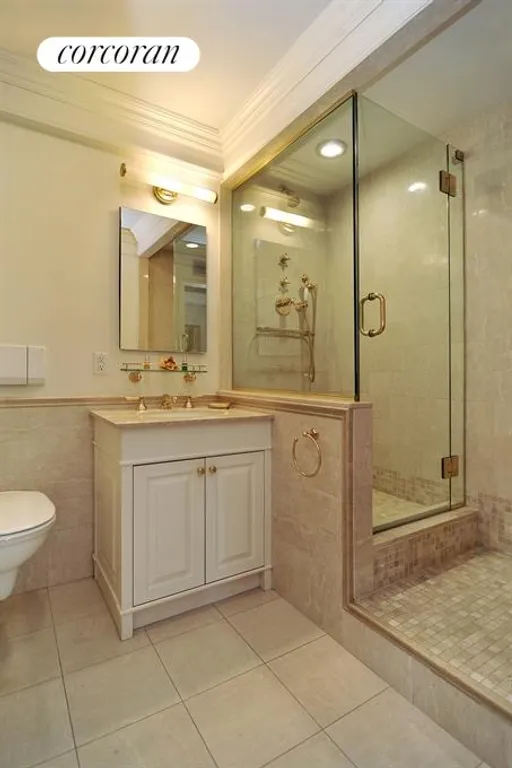 New York City Real Estate | View 130 East 63rd Street, 10B | Beautifully renovated marble bathroom | View 9