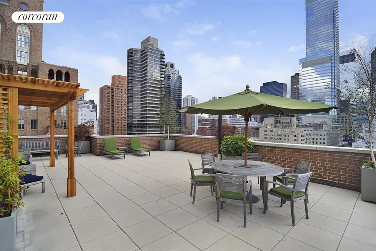 New York City Real Estate | View 130 East 63rd Street, 10B | Furnished rooftop has spectacular city views | View 12