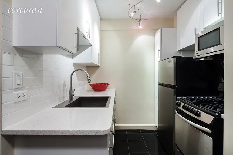 New York City Real Estate | View 166 East 61st Street, 4A | New stainless steel appliances includes dishwasher | View 2