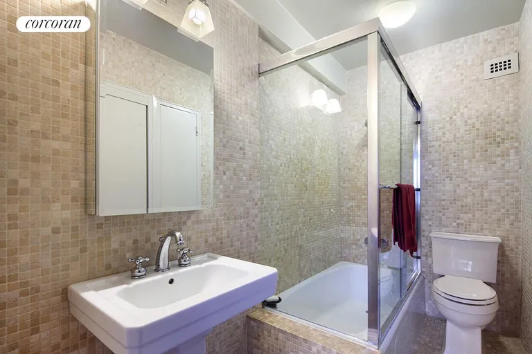 New York City Real Estate | View 166 East 61st Street, 4A | Mosaic tiled bath with pedestal sink | View 4