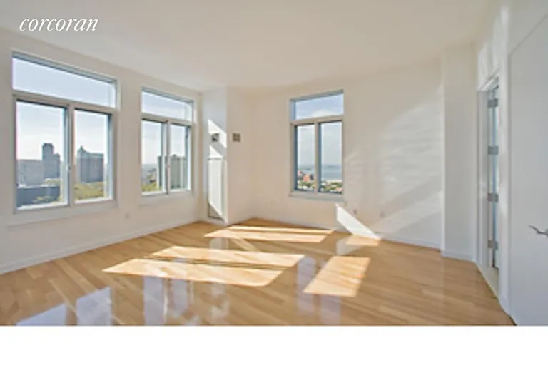 New York City Real Estate | View 85 Adams Street, 16A | South and east exposure from sunny living room. | View 3
