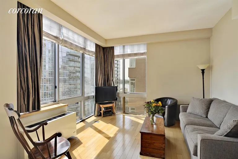 New York City Real Estate | View 225 West 60th Street, 16B | Living Room with partial river views | View 2