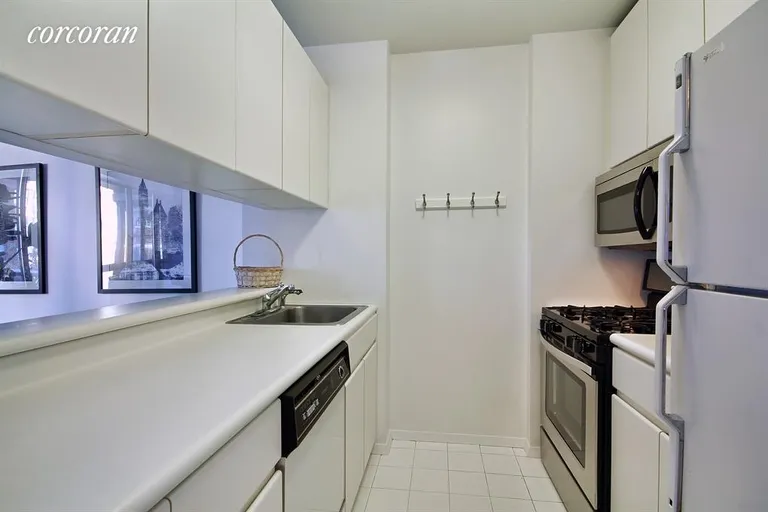 New York City Real Estate | View 300 East 62Nd Street, 704 | Pass Through Kitchen | View 2