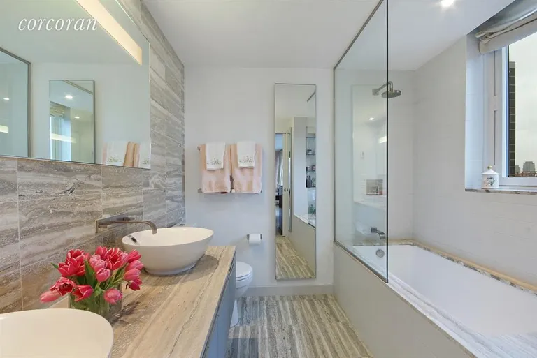 New York City Real Estate | View 322 West 57th Street, 38H3 | Master Bathroom with Window and Double Sinks | View 5