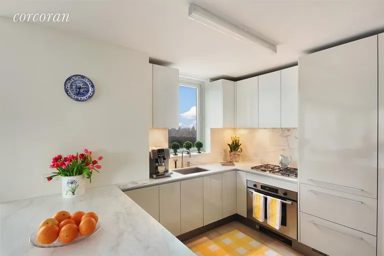 New York City Real Estate | View 322 West 57th Street, 38H3 | Open, Windowed Kitchen with Central Park Views | View 3