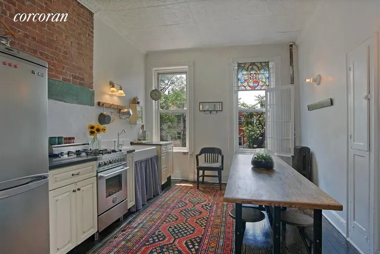 New York City Real Estate | View 158 Grand Street, 3L | Eat-in kitchen with garden views | View 2