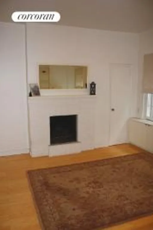 New York City Real Estate | View 32 Downing Street, 4B | Living area,fireplace | View 4