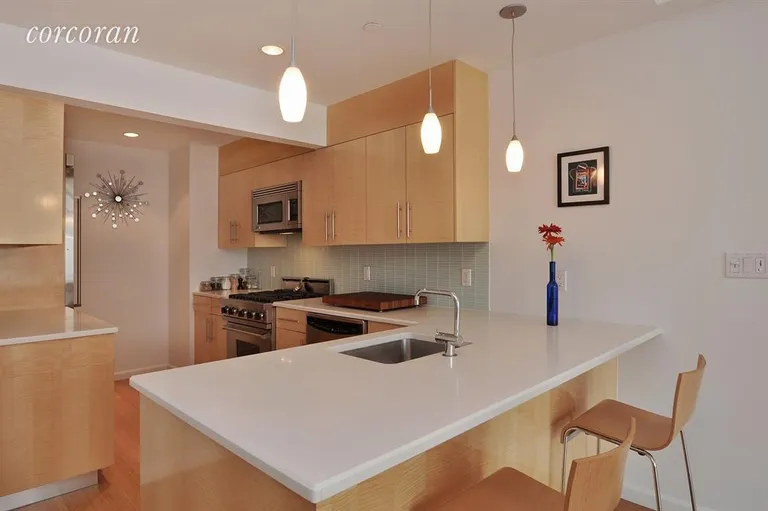 New York City Real Estate | View 26 Broadway, 503 | Sleek, clean kitchen w top of the line appliances | View 2