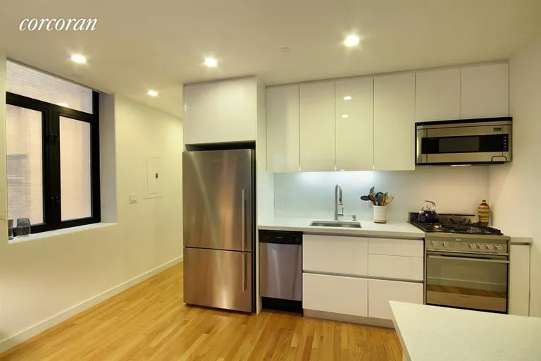 New York City Real Estate | View 148 East 24th Street, 6E | Custom white laquer cabinets. | View 2