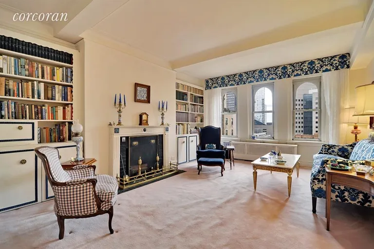 New York City Real Estate | View 60 East 96th Street, 15A | Oversized living room with open city views & WBFP | View 2