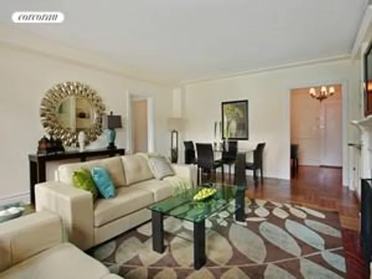 New York City Real Estate | View 10 East 85th Street, 9D | Living Room with Woodburning Fireplace | View 2