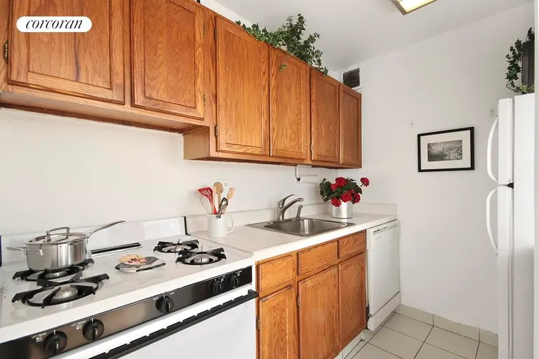 New York City Real Estate | View 77 Bleecker Street, 714 | Full kitchen with dishwasher and pass-thru window. | View 4