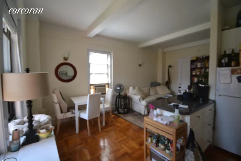 New York City Real Estate | View 133 West 71st Street, 9D | Living Room with Open Kitchen, Breakfast Counter | View 3