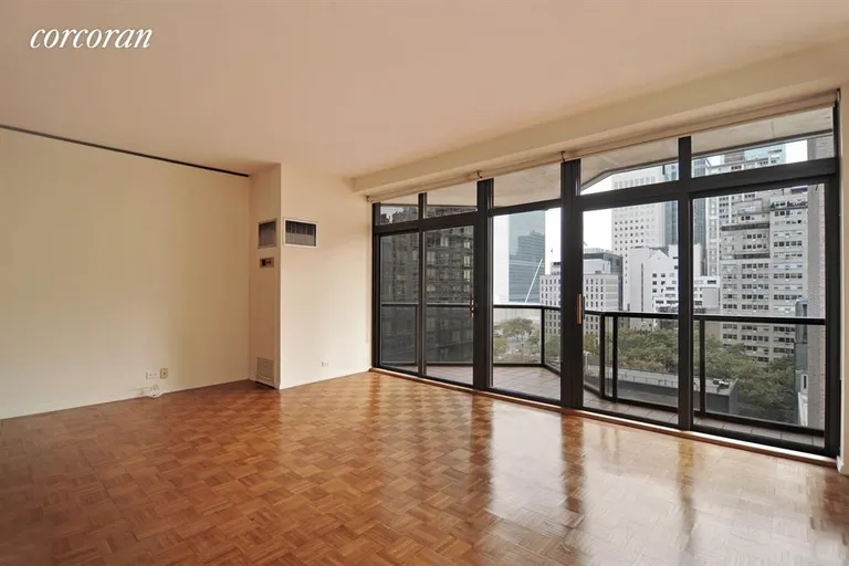 New York City Real Estate | View 100 United Nations Plaza, 15E | Great wall of windows w/ access to private balcony | View 2