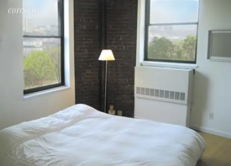 New York City Real Estate | View 214 Riverside Drive, 409 | Bedroom with views of the river and park | View 2