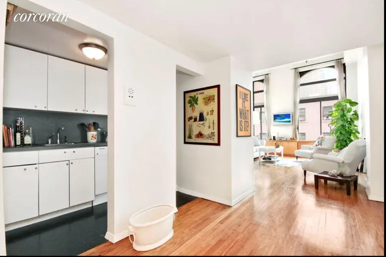 New York City Real Estate | View 67 East 11th Street, 512 | White Cabinets and open dining area | View 3