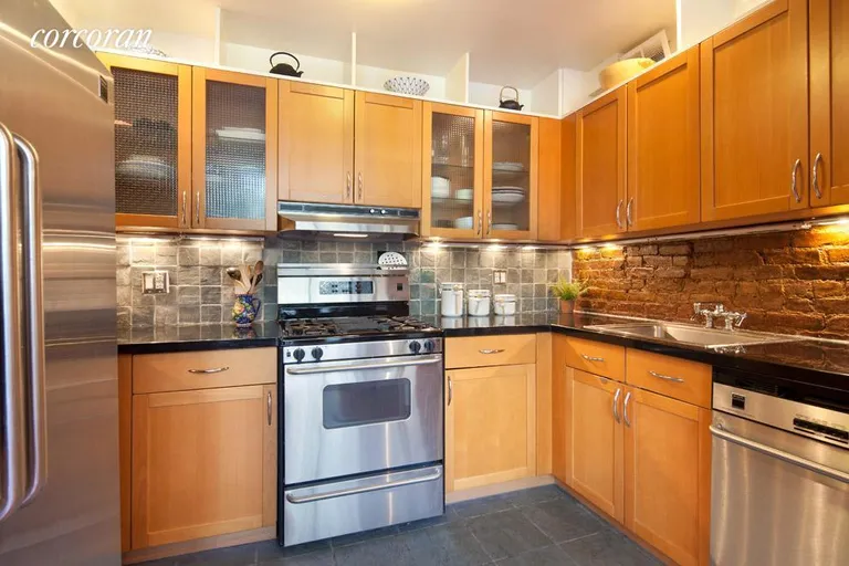 New York City Real Estate | View 77 Bleecker Street, 104 | Modern kitchen is open to living/dining area | View 2