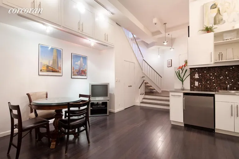 New York City Real Estate | View 77 Bleecker Street, 104 | Recreation room has 12-foot ceilings & kitchenette | View 5