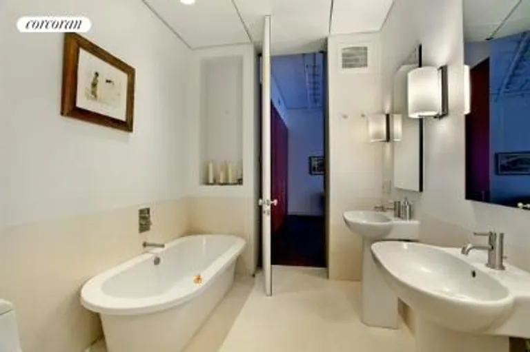 New York City Real Estate | View 35 White Street, 4 FL | Master bathroom w limestone tile, Duravit fittings | View 4