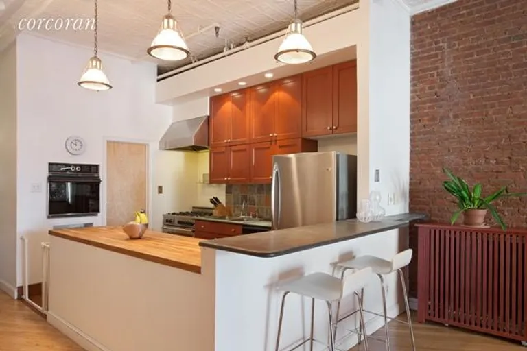 New York City Real Estate | View 716 Broadway, 3 FL | Open kitchen adjacent to dining area | View 3