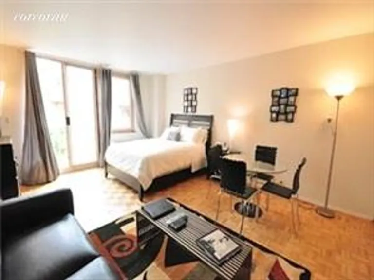 New York City Real Estate | View 393 West 49th Street, 3LL | 99 Baths | View 1