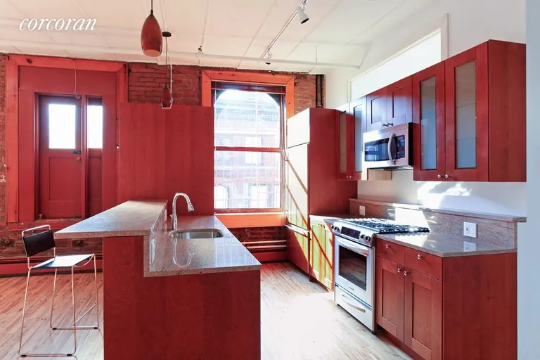 New York City Real Estate | View 132 Wooster Street, 6 FL | Open Kitchen with top of the line appliances! | View 2