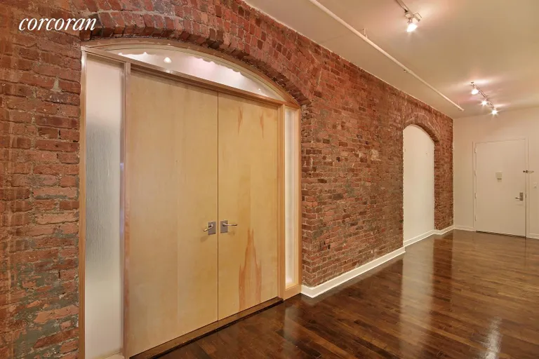 New York City Real Estate | View 345 West 13th Street, 4F | Entry Foyer with Exposed Brick Walls and Arches | View 14