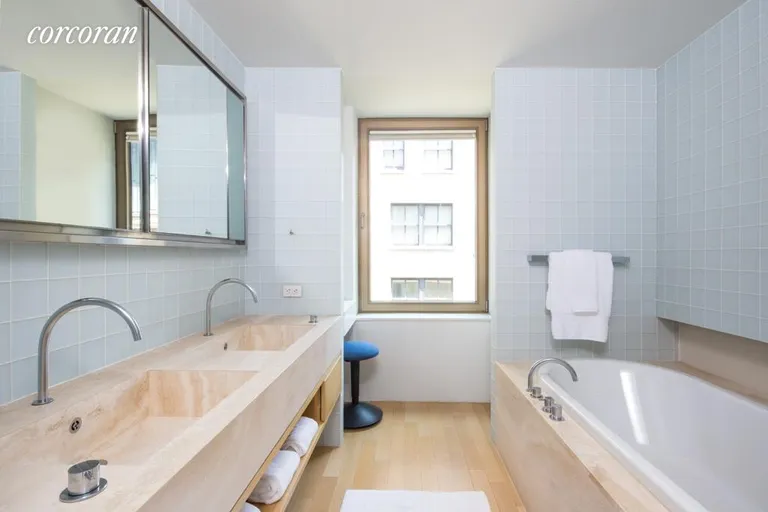 New York City Real Estate | View 50 Gramercy Park North, PARK 12A | Travertine lined Master Bathroom | View 6