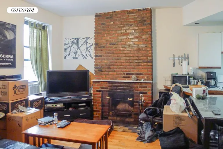 New York City Real Estate | View 2 Lincoln Place, 3R | Living Room with Wood Burning Fire Place | View 5