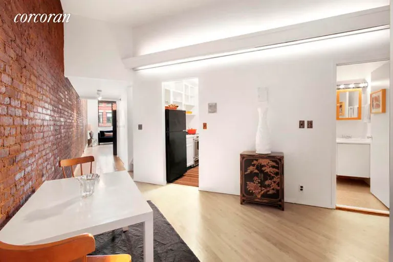 New York City Real Estate | View 77 Bleecker Street, 833N | Dining room; trendy kitchen; pickled oak floors | View 2
