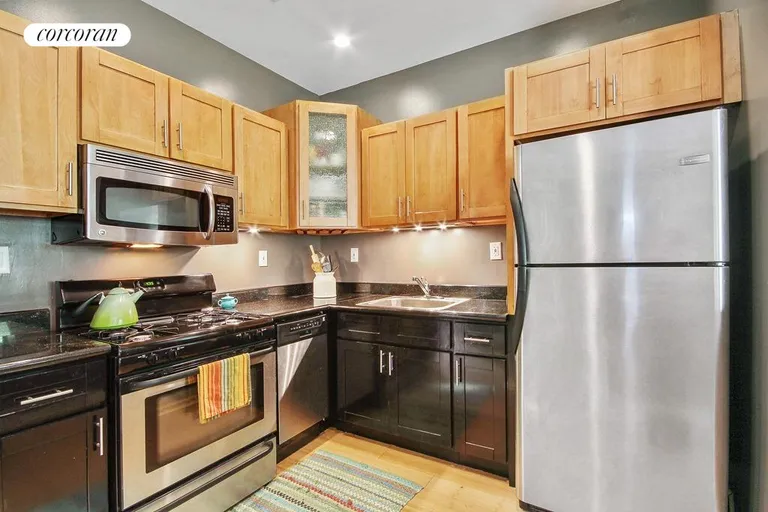 New York City Real Estate | View 31 Covert Street, 3 | Modern kitchen with gas stove and dishwasher | View 5
