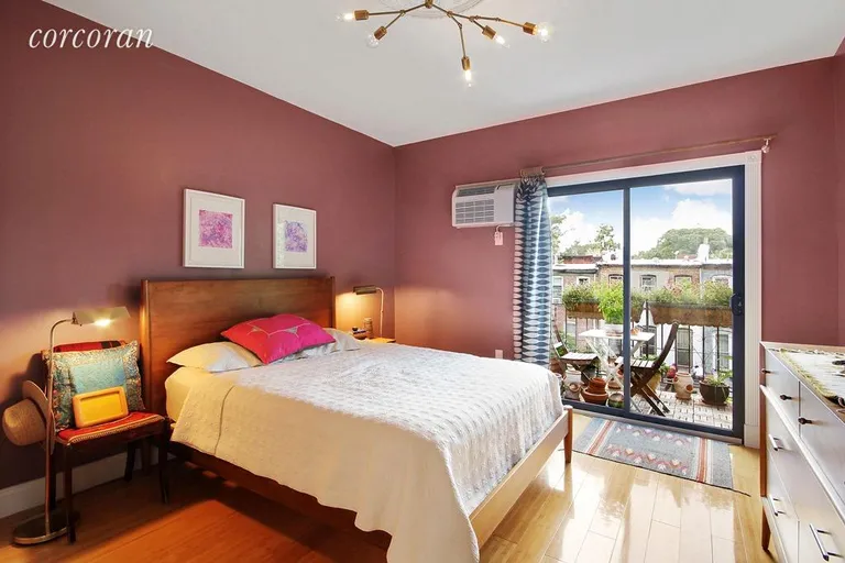 New York City Real Estate | View 31 Covert Street, 3 | Master bedroom with en suite bathroom and balcony! | View 3