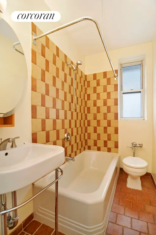 New York City Real Estate | View 305 West 52Nd Street, 4D | Windowed bath with Italian tile on walls and floor | View 6