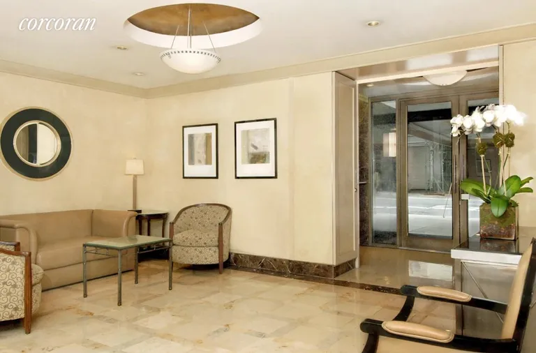 New York City Real Estate | View 153 East 57th Street, 16H | Gotham Towne House's elegant lobby | View 8