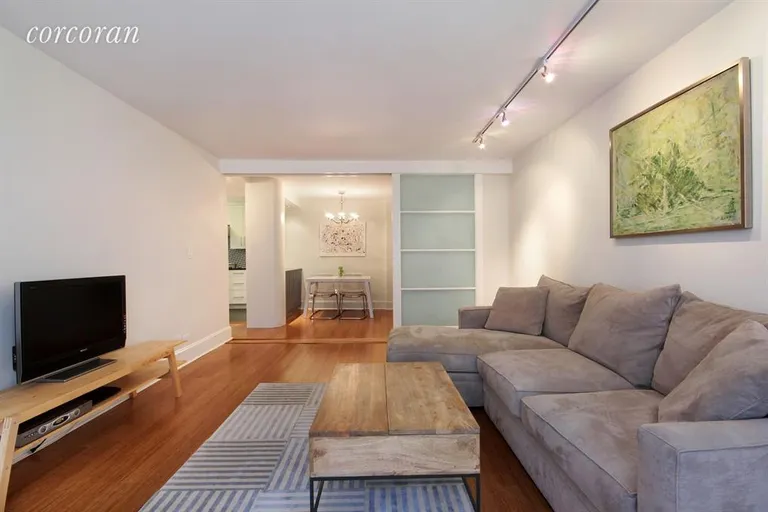 New York City Real Estate | View 10 West 15th Street, 611 | Living Room/Dining Room with frosted glass divider | View 2