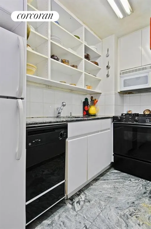 New York City Real Estate | View 230 East 15th Street, 2K | Galley kitchen with granite counters | View 3